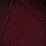 Closeup of Encore Chunky yarn swatch in colorway 0999 - deep burgundy