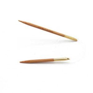 A 12 inch, bamboo circular needle on a white background