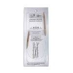 A size 8, 12 inch bamboo circular needle in its silver packaging
