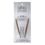 A size 9, 16 inch bamboo circular needle in its silver packaging